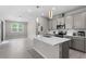 Spacious kitchen with a center island, stainless steel appliances, and tile backsplash at 4028 Southern Vista Loop, St Cloud, FL 34772