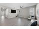 Spacious living room with tile floors, recessed lighting, ceiling fan, and large windows with natural light at 4028 Southern Vista Loop, St Cloud, FL 34772