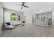 Bright, open-concept living room featuring tile floors, recessed lighting, and a ceiling fan at 4028 Southern Vista Loop, St Cloud, FL 34772