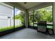 Screened patio featuring tile flooring, grill, and views of the outdoors at 4028 Southern Vista Loop, St Cloud, FL 34772