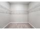 Walk-in closet with carpeted floor and wire shelving at 4028 Southern Vista Loop, St Cloud, FL 34772