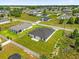 Bird's eye view displaying a backyard with green grass and proximity to surrounding neighborhood homes at 4662 Sw 136Th St, Ocala, FL 34473