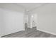 Bright bedroom with wood-look flooring and a closet with a door opening at 4662 Sw 136Th St, Ocala, FL 34473
