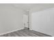 Bedroom featuring gray vinyl flooring, a standard closet with white doors and an off-white paint at 4662 Sw 136Th St, Ocala, FL 34473