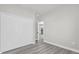 Empty bedroom featuring a large closet and wood-look flooring at 4662 Sw 136Th St, Ocala, FL 34473