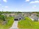 Beautiful one-story home featuring a paved driveway, well-manicured lawn, and black trim accents at 4662 Sw 136Th St, Ocala, FL 34473