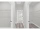 Hallway with closet and gray flooring at 4662 Sw 136Th St, Ocala, FL 34473