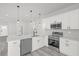 Modern kitchen featuring stainless steel appliances, white cabinets, and a sink with a view at 4662 Sw 136Th St, Ocala, FL 34473