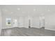 The living room features recessed lights, gray floors, and a view of the front door at 4662 Sw 136Th St, Ocala, FL 34473