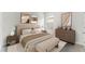 Serene bedroom with neutral tones, plush bedding, and stylish decor at 5120 Gopher Apple Dr, Apopka, FL 32712