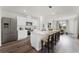 Modern kitchen features stainless steel appliances, a spacious island with seating, and an open layout at 5120 Gopher Apple Dr, Apopka, FL 32712