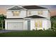 Charming two-story home featuring a two-car garage and well-manicured lawn at 5530 Settlingstone Ln, St Cloud, FL 34771