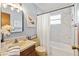 Well-maintained bathroom with a tub, updated fixtures, and soft, calming colors offers a relaxing and inviting atmosphere at 7040 Betty St, Winter Park, FL 32792