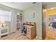Well-lit bedroom with a desk and shelves, perfect for studying or working from home at 7040 Betty St, Winter Park, FL 32792