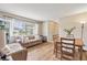 Inviting living room with wood flooring, bright window, and comfortable seating for relaxing or entertaining at 7040 Betty St, Winter Park, FL 32792