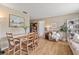 Cozy dining area featuring natural light, wood flooring, and seamless flow to living space at 7040 Betty St, Winter Park, FL 32792