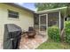 Cozy patio with a grill and outdoor seating, perfect for enjoying outdoor dining and relaxation at 7040 Betty St, Winter Park, FL 32792