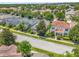 Beautiful homes in a serene neighborhood with tree-lined streets and well-manicured lawns at 7416 Soiree Way, Reunion, FL 34747
