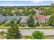 Well-maintained home nestled in a lush, green neighborhood with mature trees and landscaping at 7416 Soiree Way, Reunion, FL 34747
