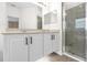 Bright bathroom with dual sinks, large mirror and shower at 7416 Soiree Way, Reunion, FL 34747