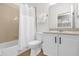 This bathroom features a shower, toilet, vanity and neutral paint to make it the perfect powder room at 7416 Soiree Way, Reunion, FL 34747