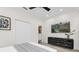 Well-lit bedroom features neutral decor, window blinds, and a comfortable bed at 7416 Soiree Way, Reunion, FL 34747