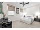 Well-lit bedroom features neutral decor, window blinds, and a comfortable bed at 7416 Soiree Way, Reunion, FL 34747