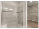 Bathroom features a glass enclosed shower and walk-in closet with wire shelving at 1046 Grand Hilltop Dr, Apopka, FL 32703