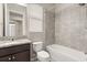 Bathroom features granite counters, tile backsplash, and shower-tub combination at 1046 Grand Hilltop Dr, Apopka, FL 32703