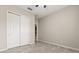 Neutral bedroom with light gray walls, tiled floor, and double-door closet at 1046 Grand Hilltop Dr, Apopka, FL 32703