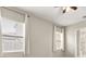 Neutral bedroom with two windows and natural light at 1046 Grand Hilltop Dr, Apopka, FL 32703