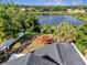 Aerial view of the backyard with a wooden deck and lake views at 1108 Summer Lakes Dr, Orlando, FL 32835