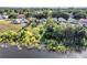 Aerial view features houses and lake with trees in the backyard at 1108 Summer Lakes Dr, Orlando, FL 32835