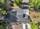 Overhead aerial view of the roof, backyard, and wooded surroundings at 1108 Summer Lakes Dr, Orlando, FL 32835
