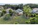 Aerial view of the backyard with deck and patio; lush, green space at 1108 Summer Lakes Dr, Orlando, FL 32835