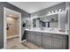 The bathroom features a double sink vanity, a large mirror, and a walk-in shower at 1108 Summer Lakes Dr, Orlando, FL 32835