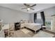 Cozy bedroom with a ceiling fan, a writing desk, and a window for natural lighting at 1108 Summer Lakes Dr, Orlando, FL 32835
