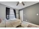 Comfortable bedroom with a ceiling fan, large window, and plush white rug at 1108 Summer Lakes Dr, Orlando, FL 32835