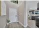 Welcoming entryway featuring wood-look tile and direct access to the kitchen at 1108 Summer Lakes Dr, Orlando, FL 32835