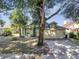 Charming single-story home with mature trees and a two-car garage at 1108 Summer Lakes Dr, Orlando, FL 32835