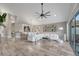 Bright open-concept living room with hardwood floors and large sliding glass doors to the lanai at 1108 Summer Lakes Dr, Orlando, FL 32835