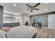 Large main bedroom features an en suite bathroom, tv, ceiling fan, and modern decor at 1108 Summer Lakes Dr, Orlando, FL 32835