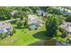 Gorgeous home with a screened pool, lush greenery, and serene water view, creating a private outdoor oasis at 1125 Almond Tree Cir, Orlando, FL 32835