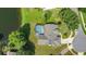 A bird's-eye view of a lovely home, showcasing its screened-in pool and beautifully landscaped surroundings at 1125 Almond Tree Cir, Orlando, FL 32835