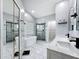 Spa like bathroom featuring double vanities, soaker tub, glass enclosed shower and sleek fixtures at 1125 Almond Tree Cir, Orlando, FL 32835
