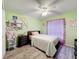 Light and bright bedroom with window, wood-look flooring and a ceiling fan at 1125 Almond Tree Cir, Orlando, FL 32835