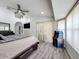 Spacious bedroom with an arcade game, large window and modern ceiling fan for maximum comfort at 1125 Almond Tree Cir, Orlando, FL 32835