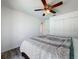 Bedroom featuring a ceiling fan and closet and laminate flooring at 1125 Almond Tree Cir, Orlando, FL 32835