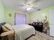 Light and bright bedroom with window, wood-look flooring and a ceiling fan at 1125 Almond Tree Cir, Orlando, FL 32835