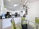 Breakfast nook adjacent to the kitchen with modern lighting and seating for four at 1125 Almond Tree Cir, Orlando, FL 32835